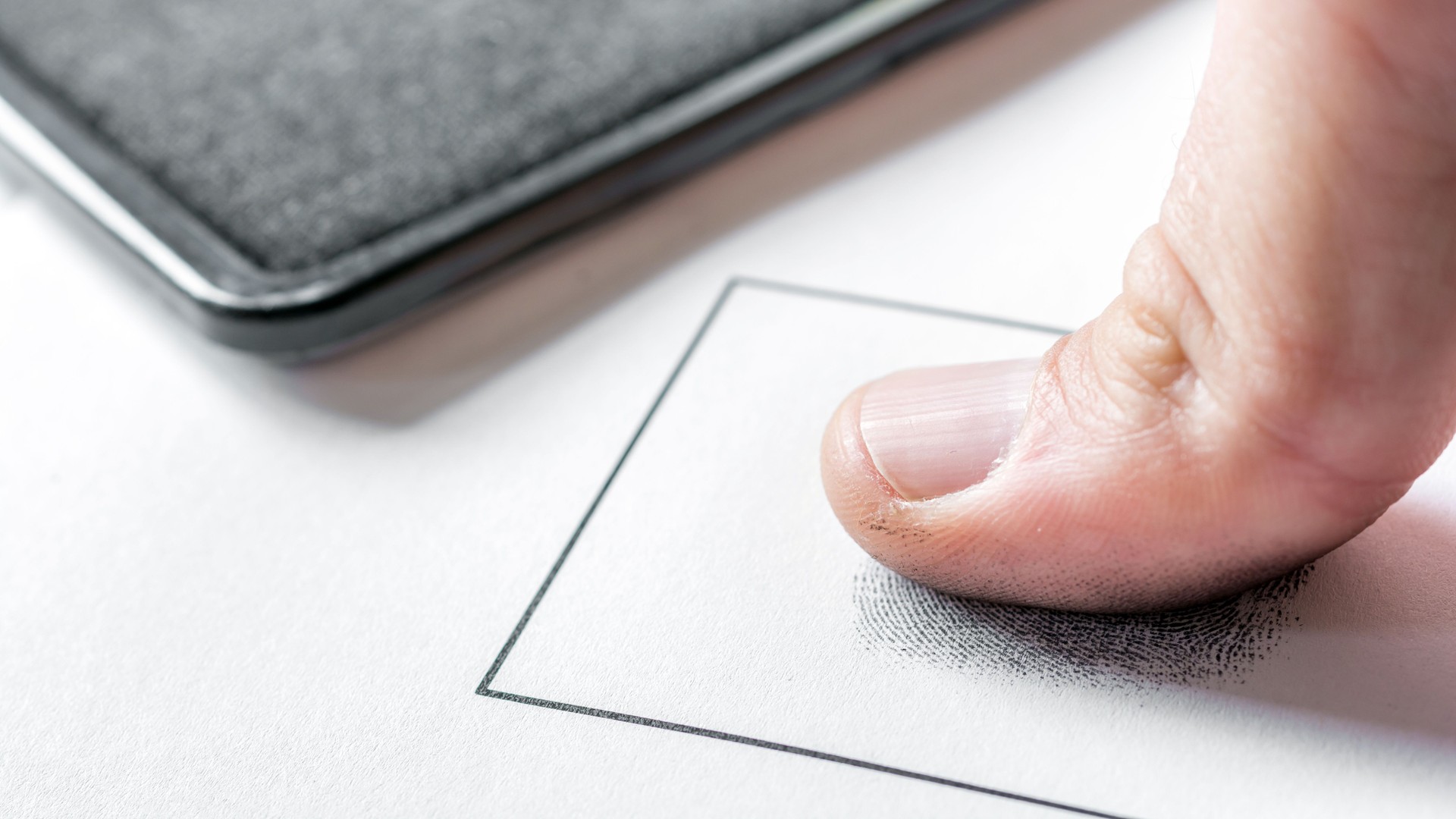 Male fingerprint is taken